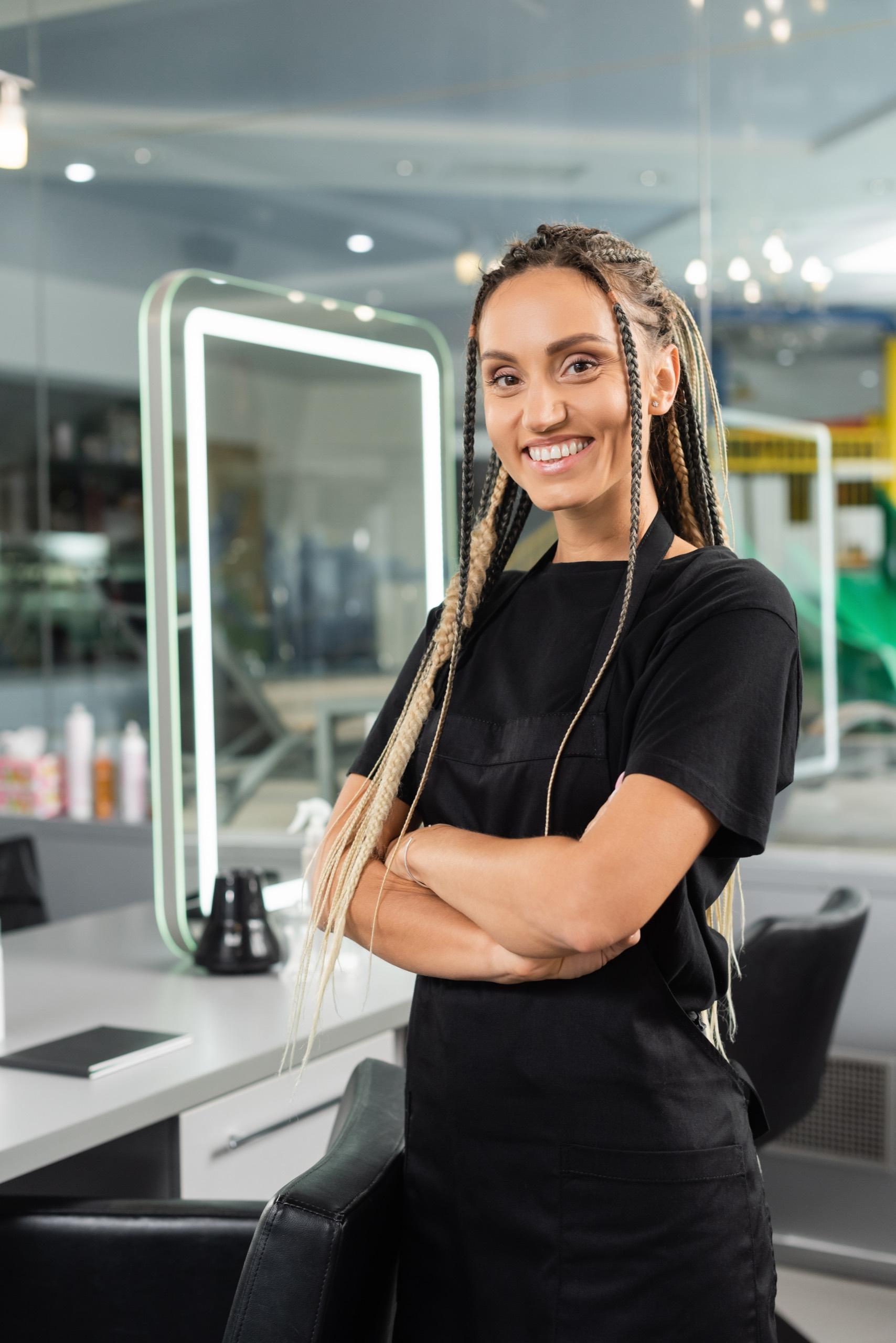 A stylist warmly welcoming a returning client
